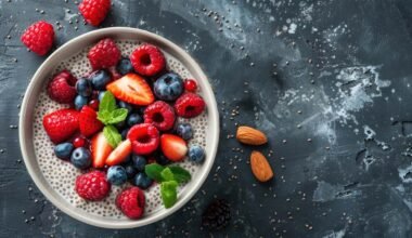 Banana Chia Seed Pudding topped with berries on black slab.