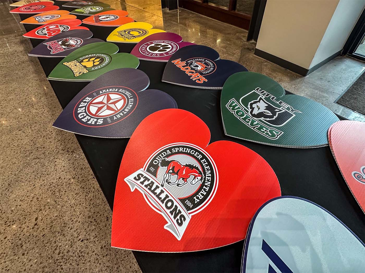 Heart shaped school campus logo signs.