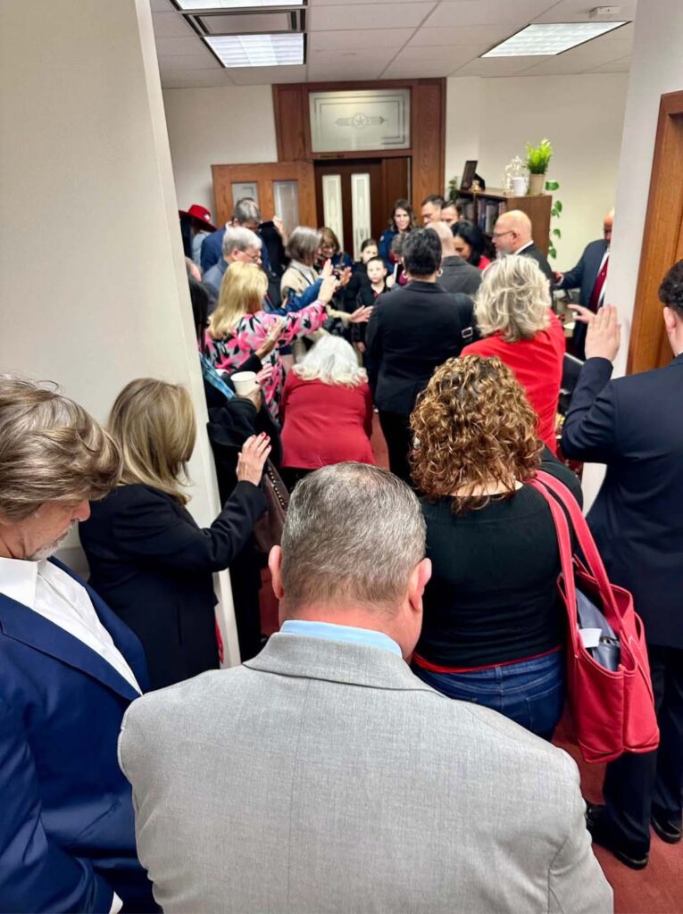 Rockwall Republicans praying at the HD33 Office on Opening Day