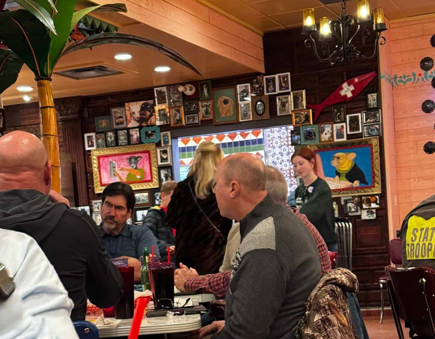 Photo of Bryan McNeal, Dennis London, and others strategizing at Chuy’s in Terrell, Texas, on January 7, 2025