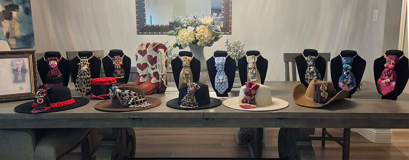 Lua S Design display of custom hats and ties showcased at a “Devil Wears Prada” themed charity event