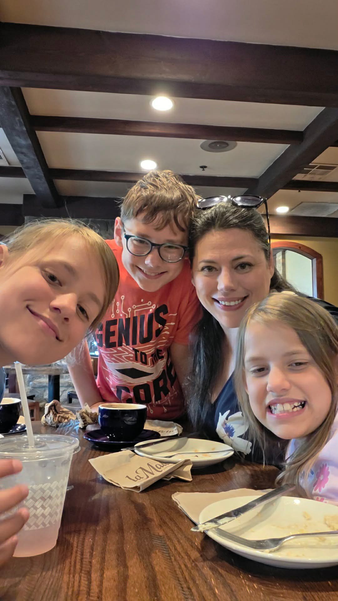 Adrienne Balkum and children enjoying pastries and chai lattes at La Madeleine before museum visit