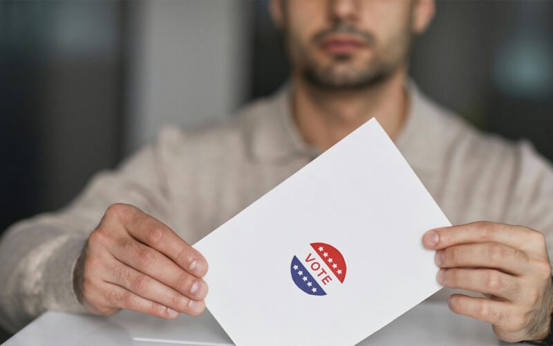 Man holding a vote in his hands