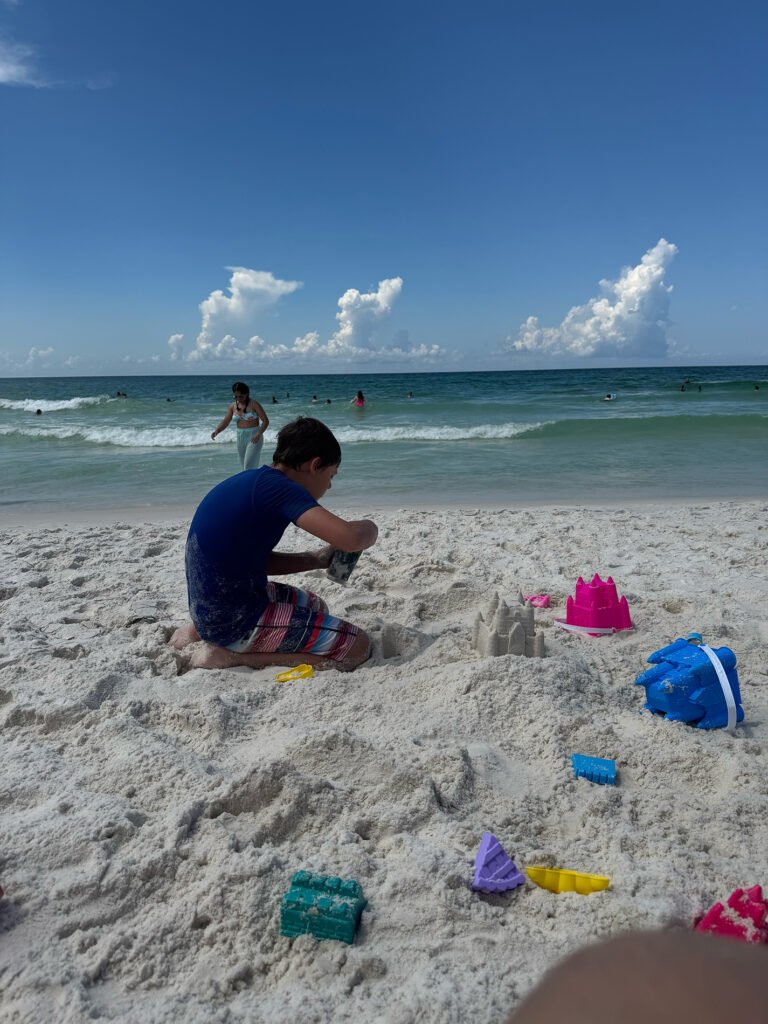Corban making sandcastles.