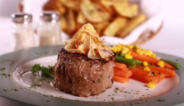 Gourmet steak, vegetables and fries.