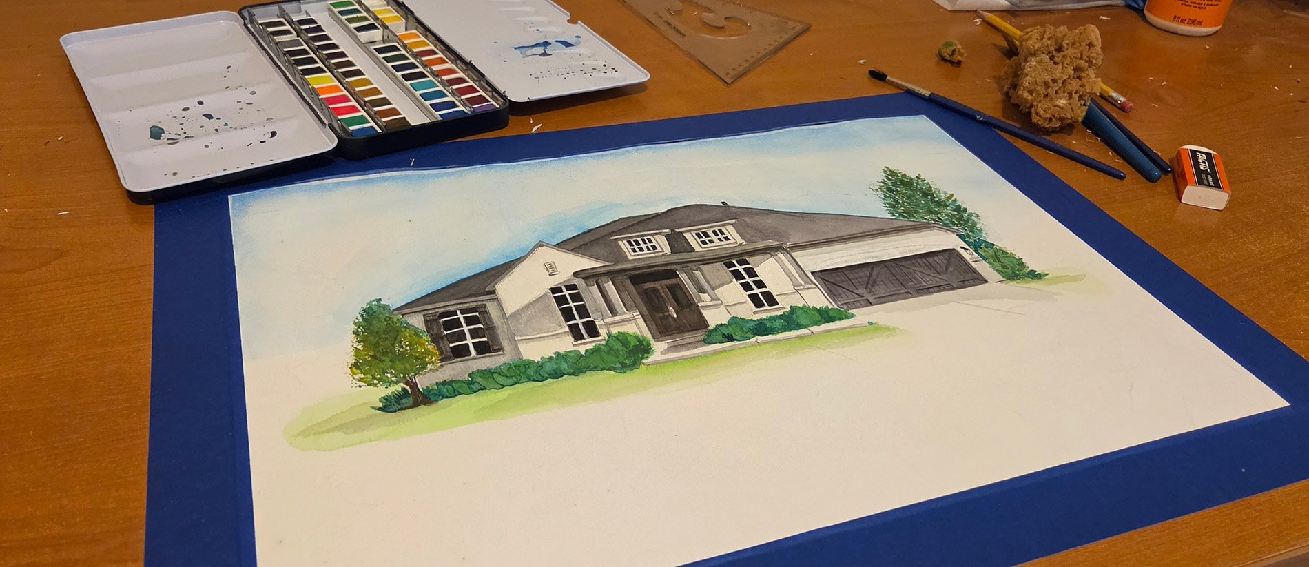 Watercolor painting in progress on Adrienne Balkum's art table