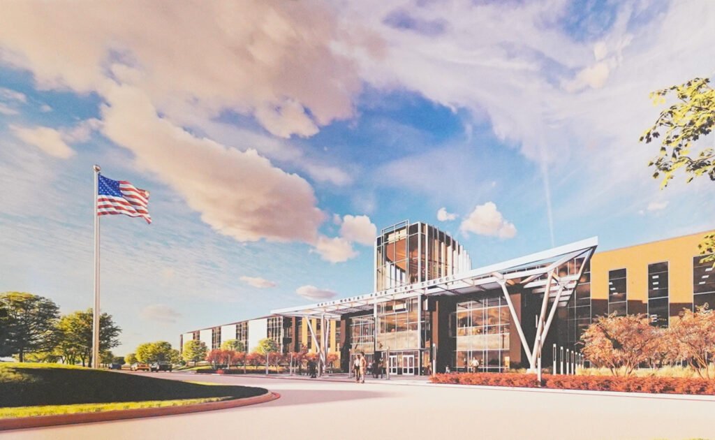 Architectural rendering of the planned Kevin Worthy Fate High School campus in Fate, Texas, showing the main entrance and exterior design.