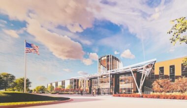 Architectural rendering of the planned Kevin Worthy Fate High School campus in Fate, Texas, showing the main entrance and exterior design.