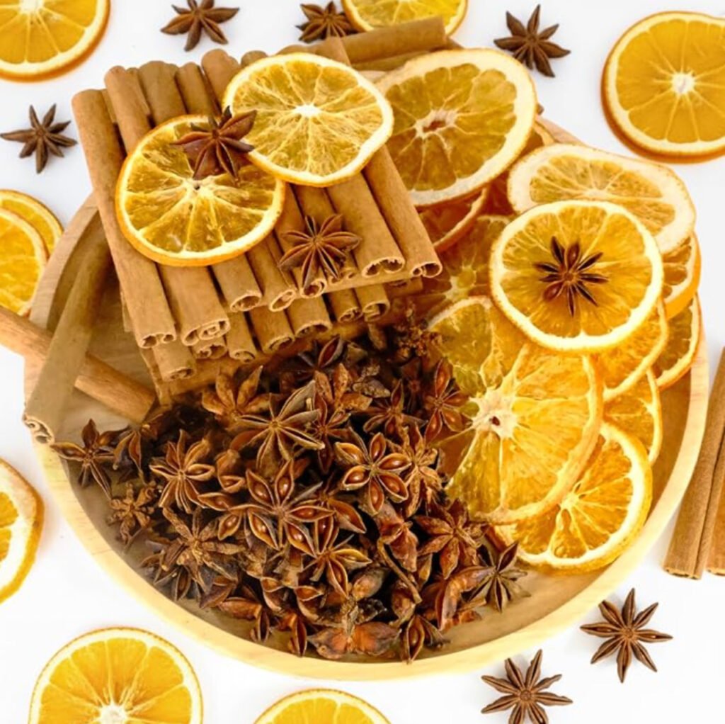 Christmas simmer pot potpourri mix featuring dried orange slices, cinnamon sticks, and whole star anise.